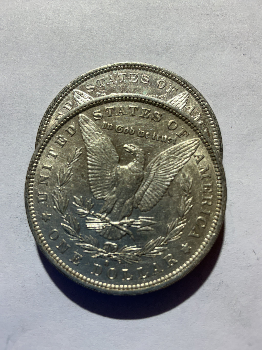 Lot 45, 2 1882 O Morgan silver dollar, AU