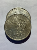 Lot 44, 2 1882 O Morgan silver dollar, AU