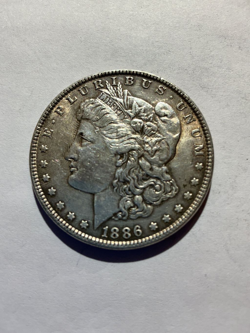 Lot 52, 1886 Morgan silver dollar, AU