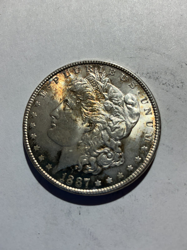 Lot 38, 1887 Morgan silver dollar,AU