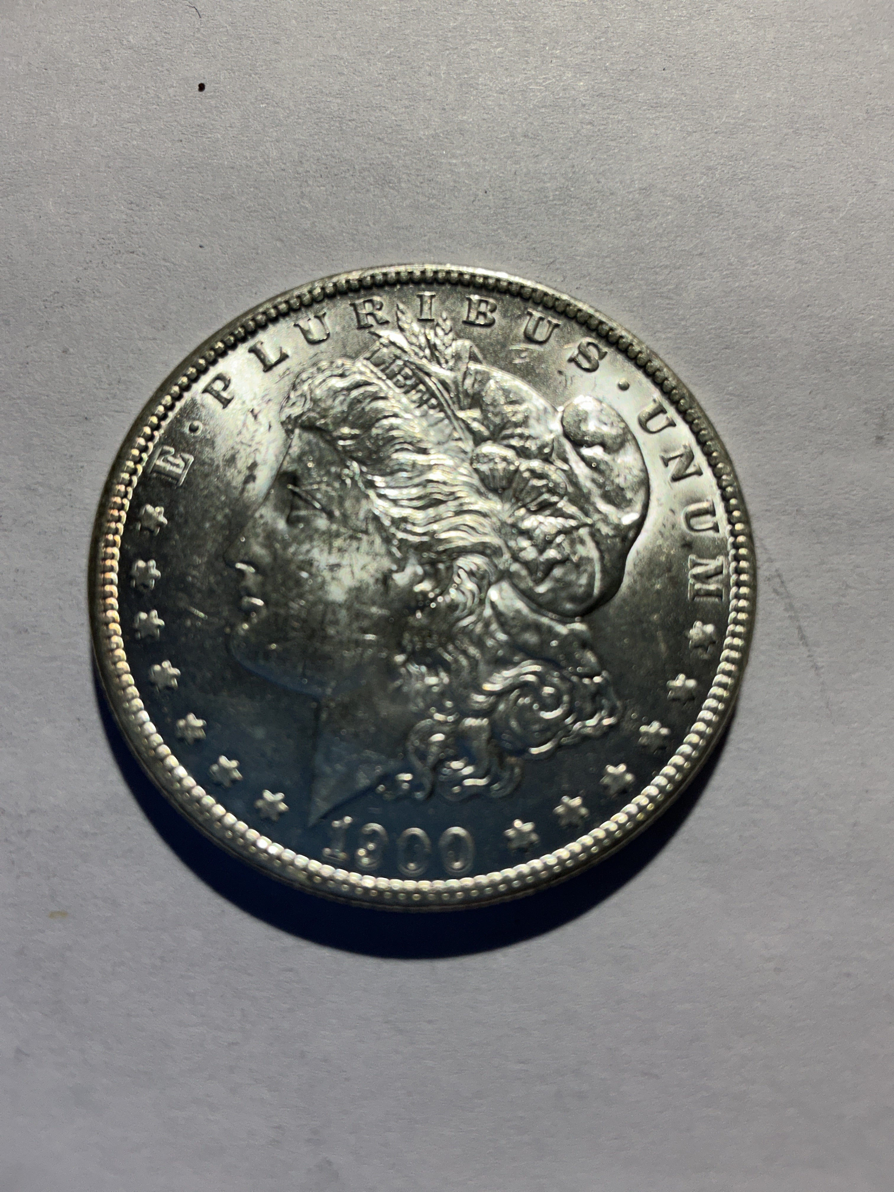 Lot 38, 1900 O Morgan silver dollar, BU