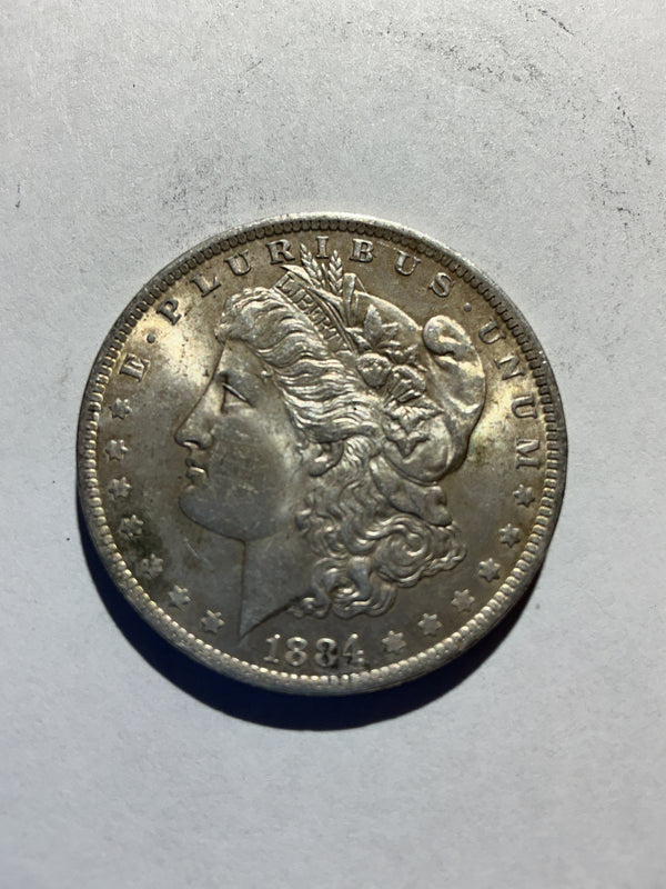 Lot 42, 1884 O Morgan silver dollar, AU