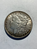 Lot 60, 1886 Morgan silver dollar, AU