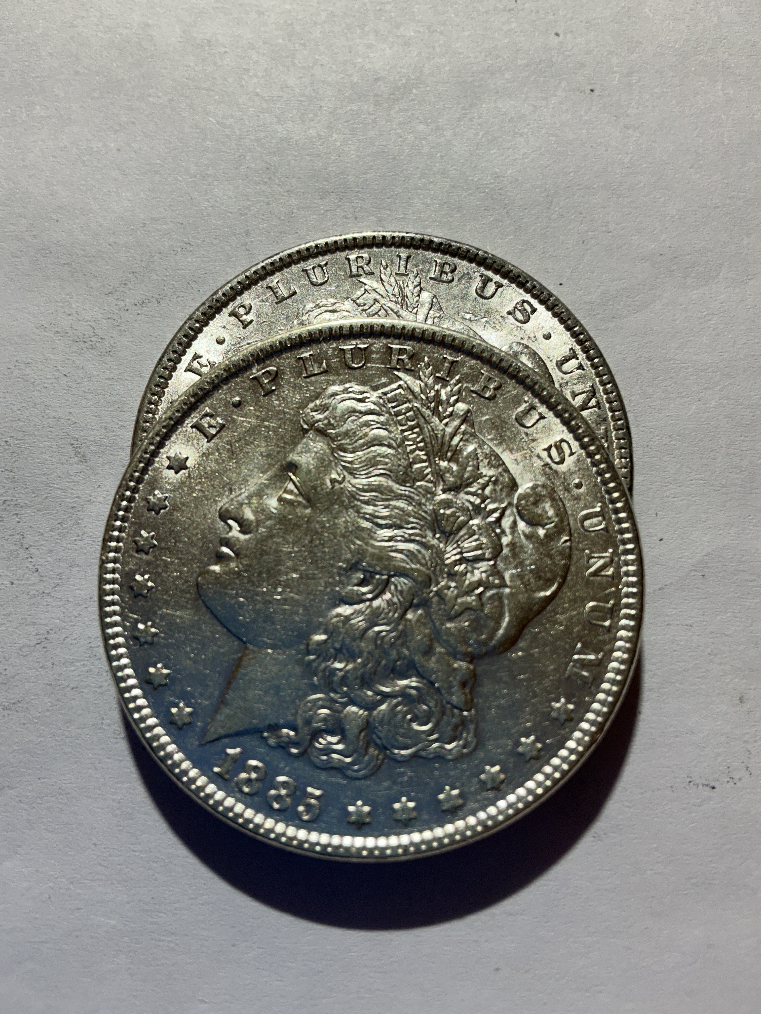 Lot 51, 2 1885 Morgan silver dollar, AU