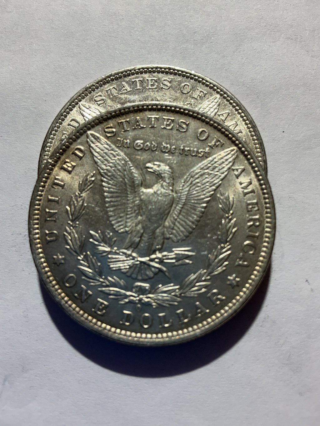 Lot 43, 2 1881 O Morgan silver dollar, AU