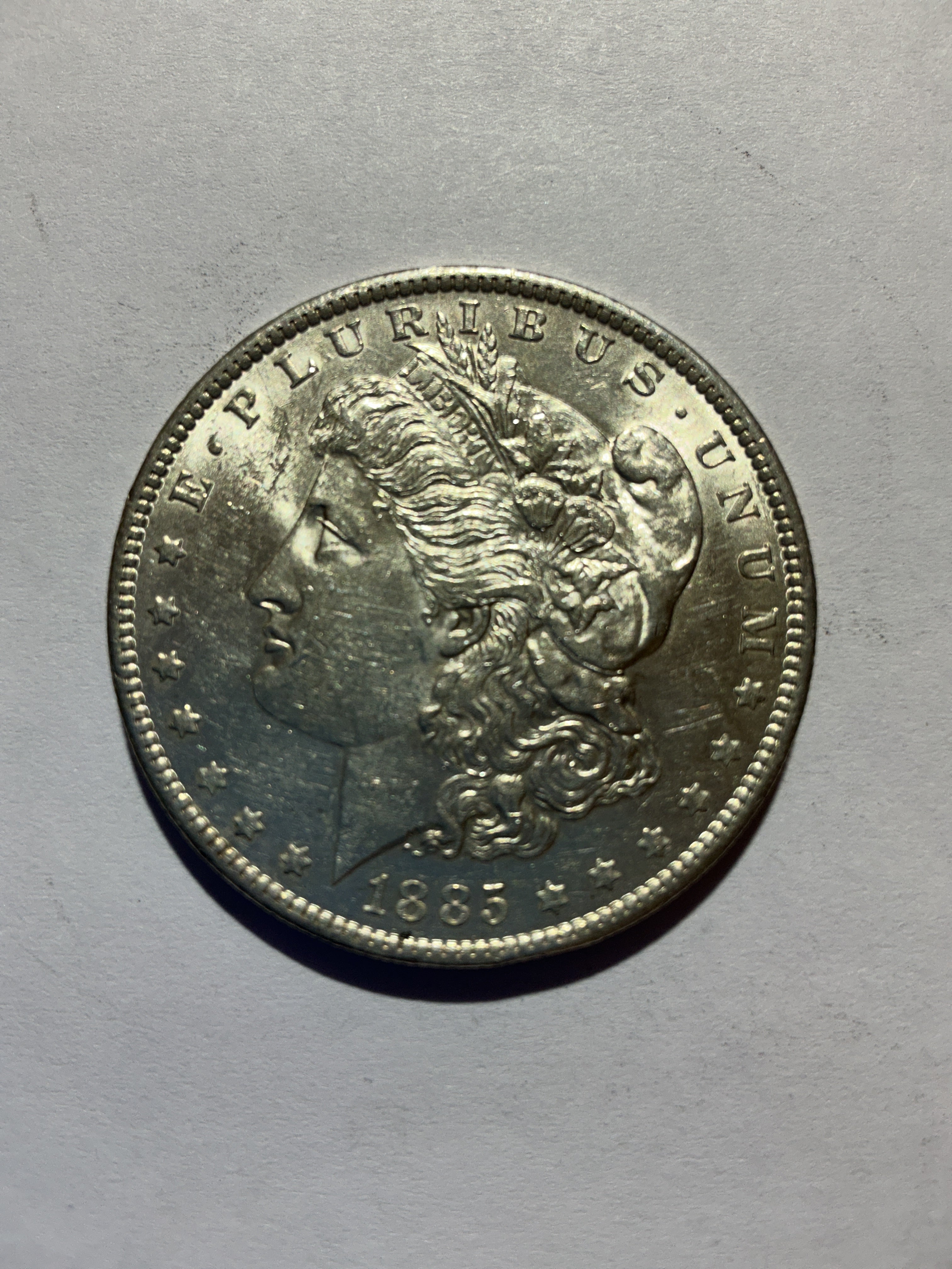 Lot 10, 1885 O Morgan silver dollar, AU
