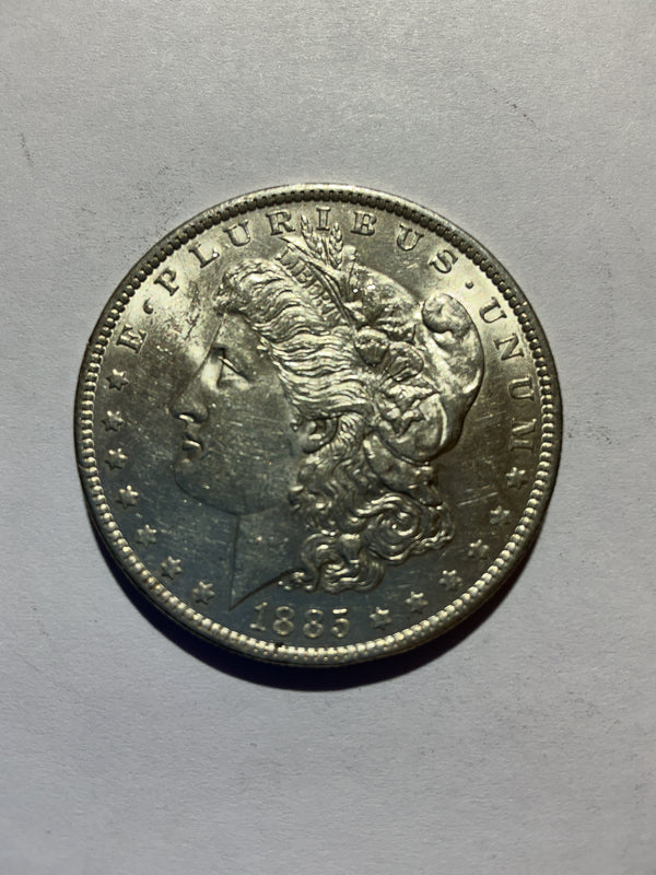 Lot 10, 1885 O Morgan silver dollar, AU