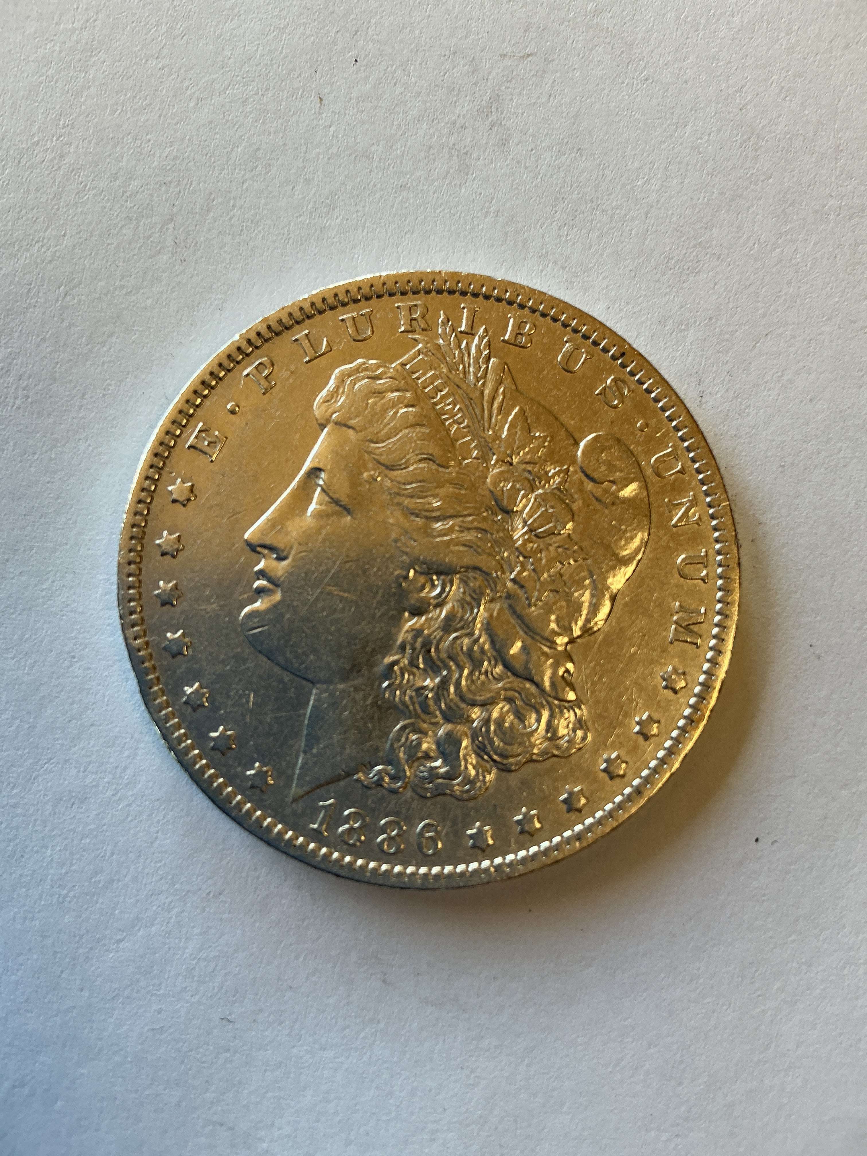 Lot 9, 1886 O Morgan silver dollar, Au