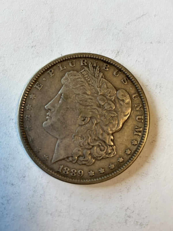 Lot 31, 1889 Morgan silver dollar, xf