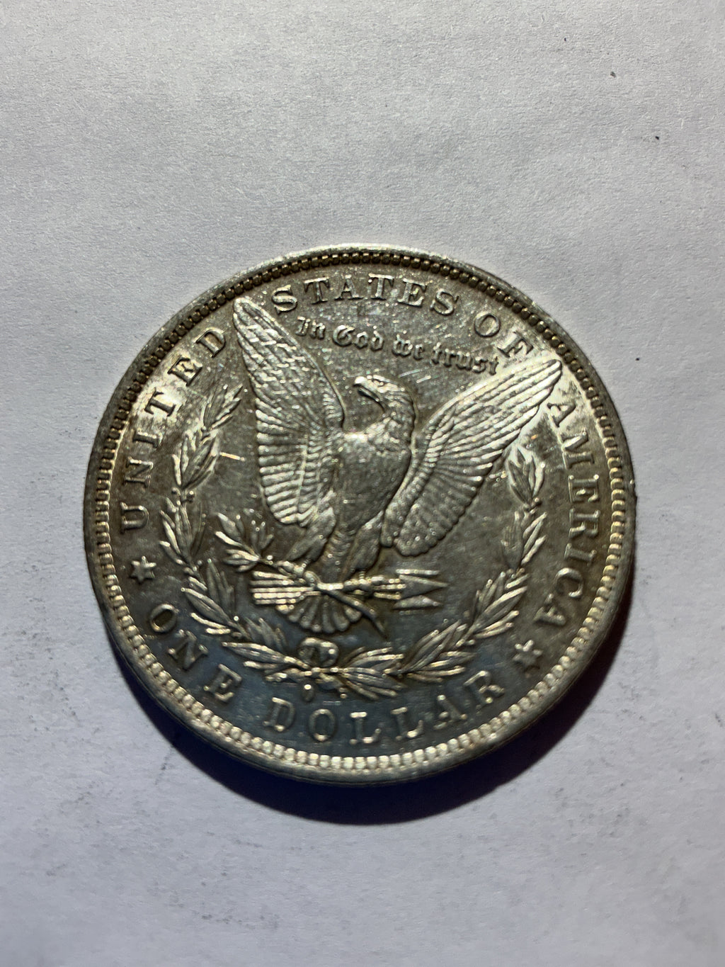 Lot 49, 1884 O Morgan silver dollar, AU