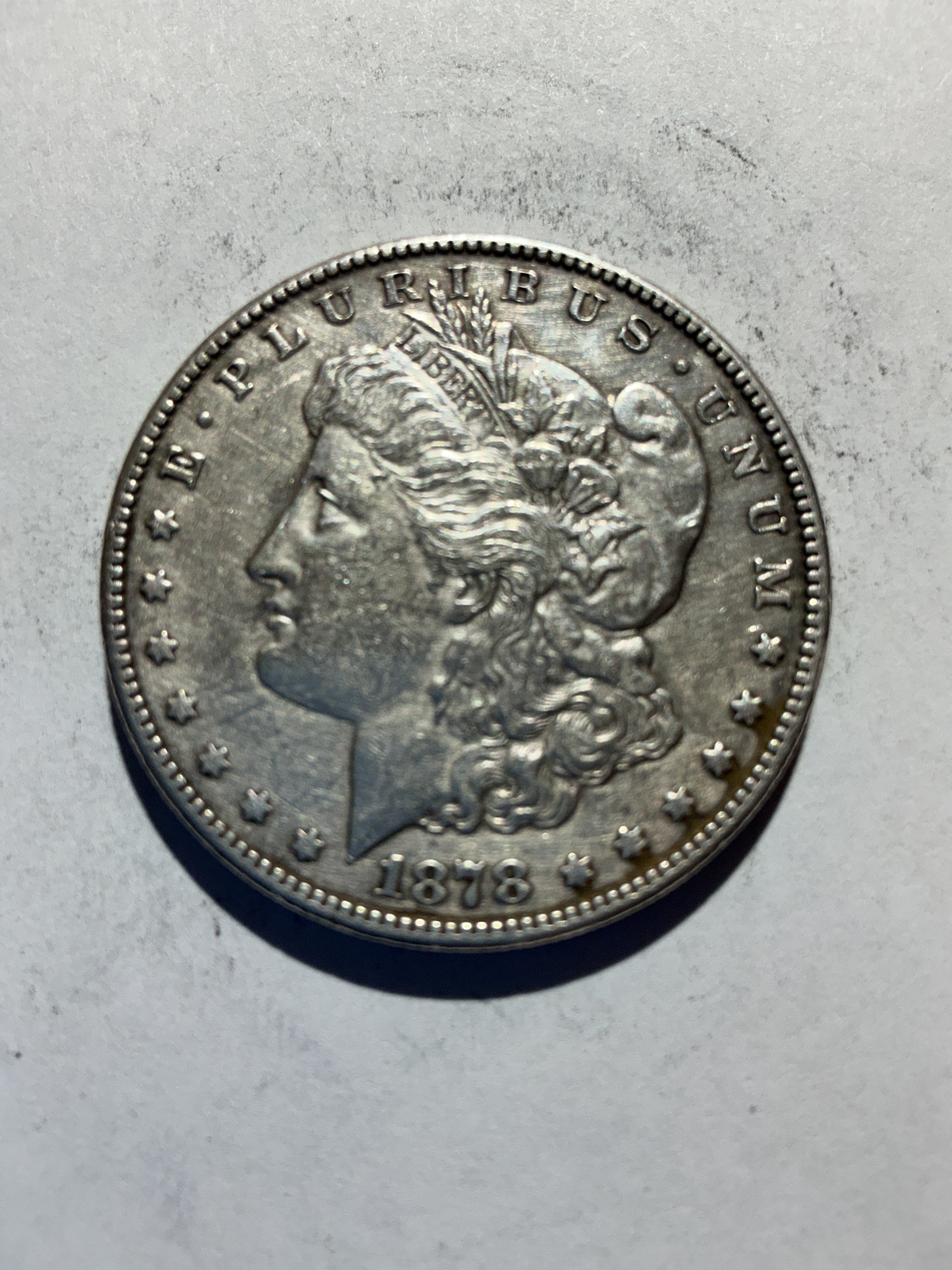 Lot 57, 1878 S Morgan silver dollar, AU