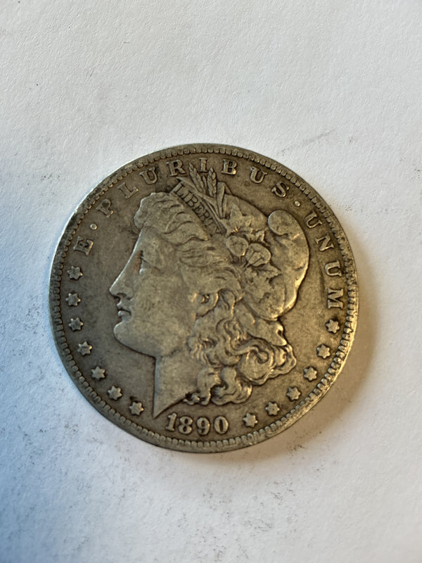 Lot 33, 1890 O Morgan silver dollar, vf
