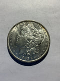 Lot 48, 1885 O Morgan silver dollar, AU