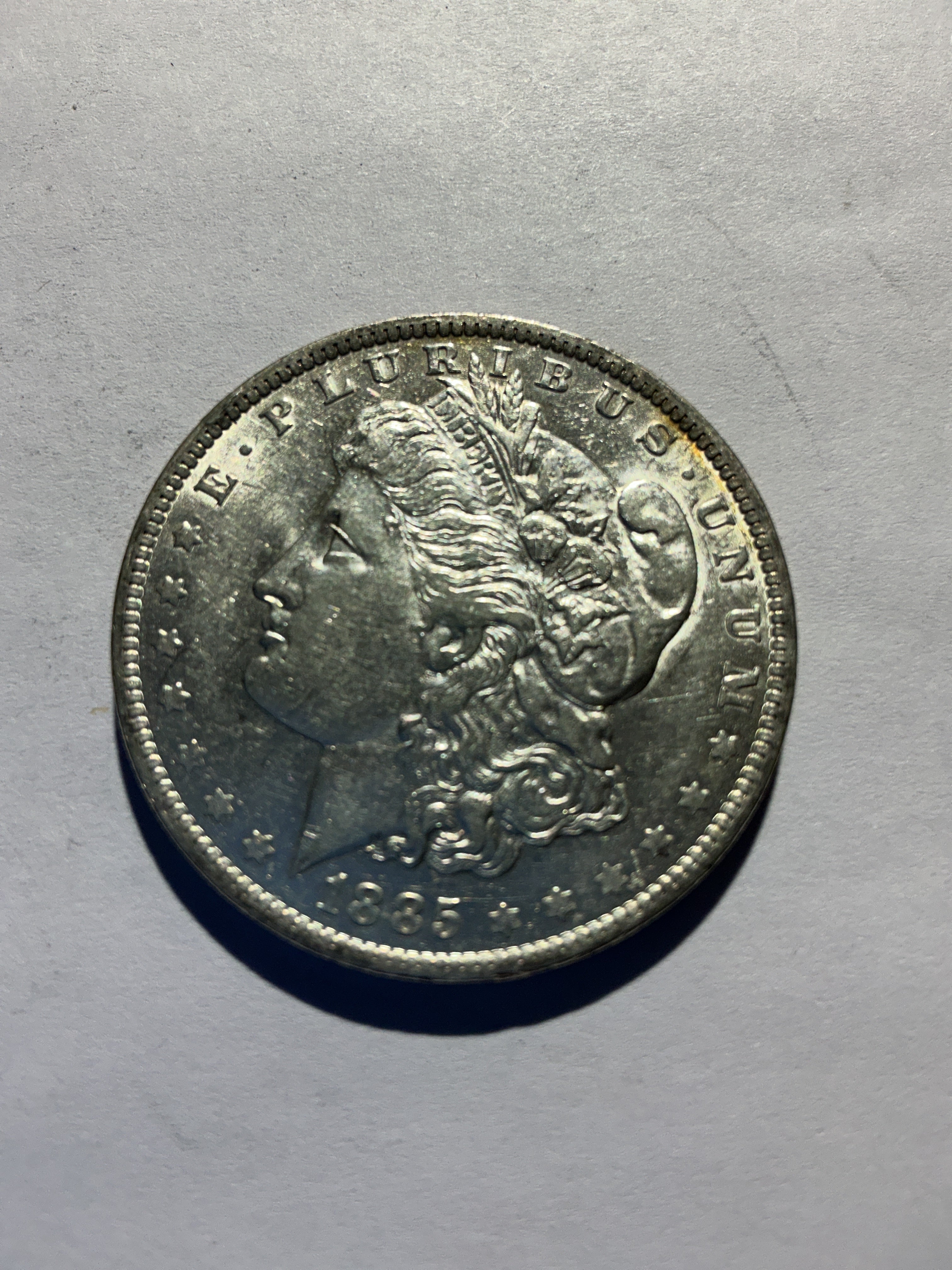 Lot 48, 1885 O Morgan silver dollar, AU