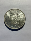 Lot 28, 1884 O Morgan silver dollar, BU