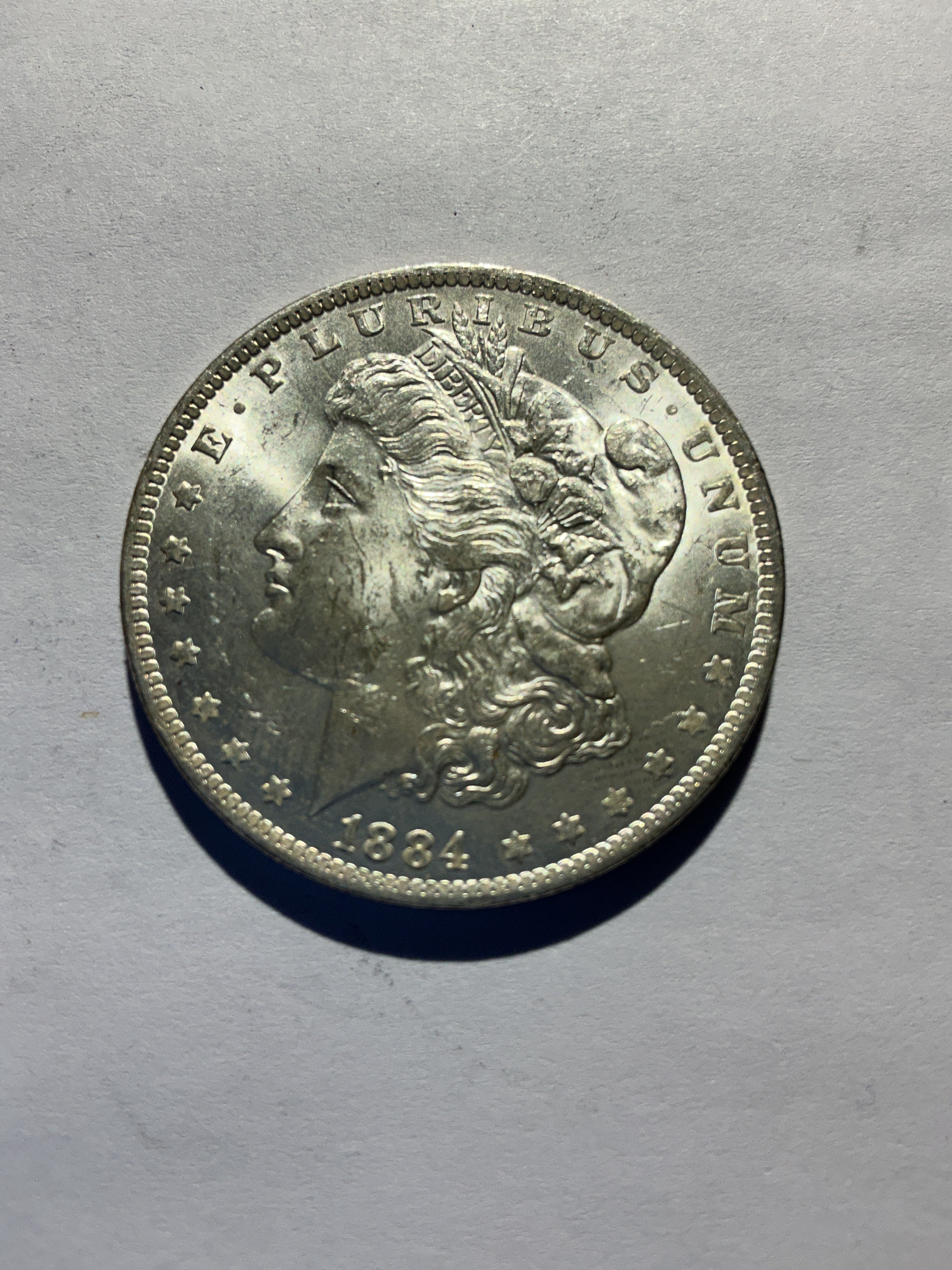 Lot 28, 1884 O Morgan silver dollar, BU