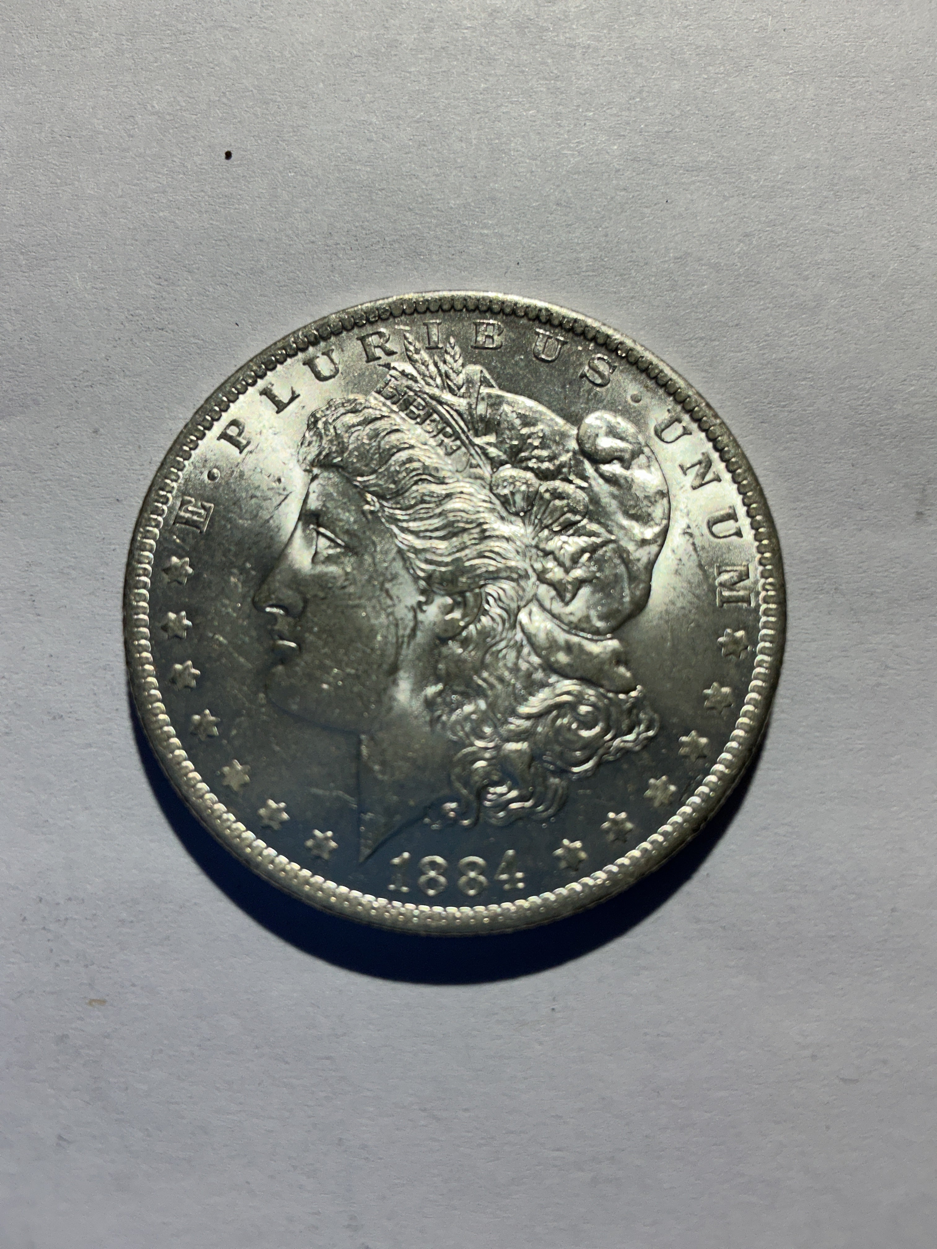 Lot 26, 1884 O Morgan silver dollar, BU