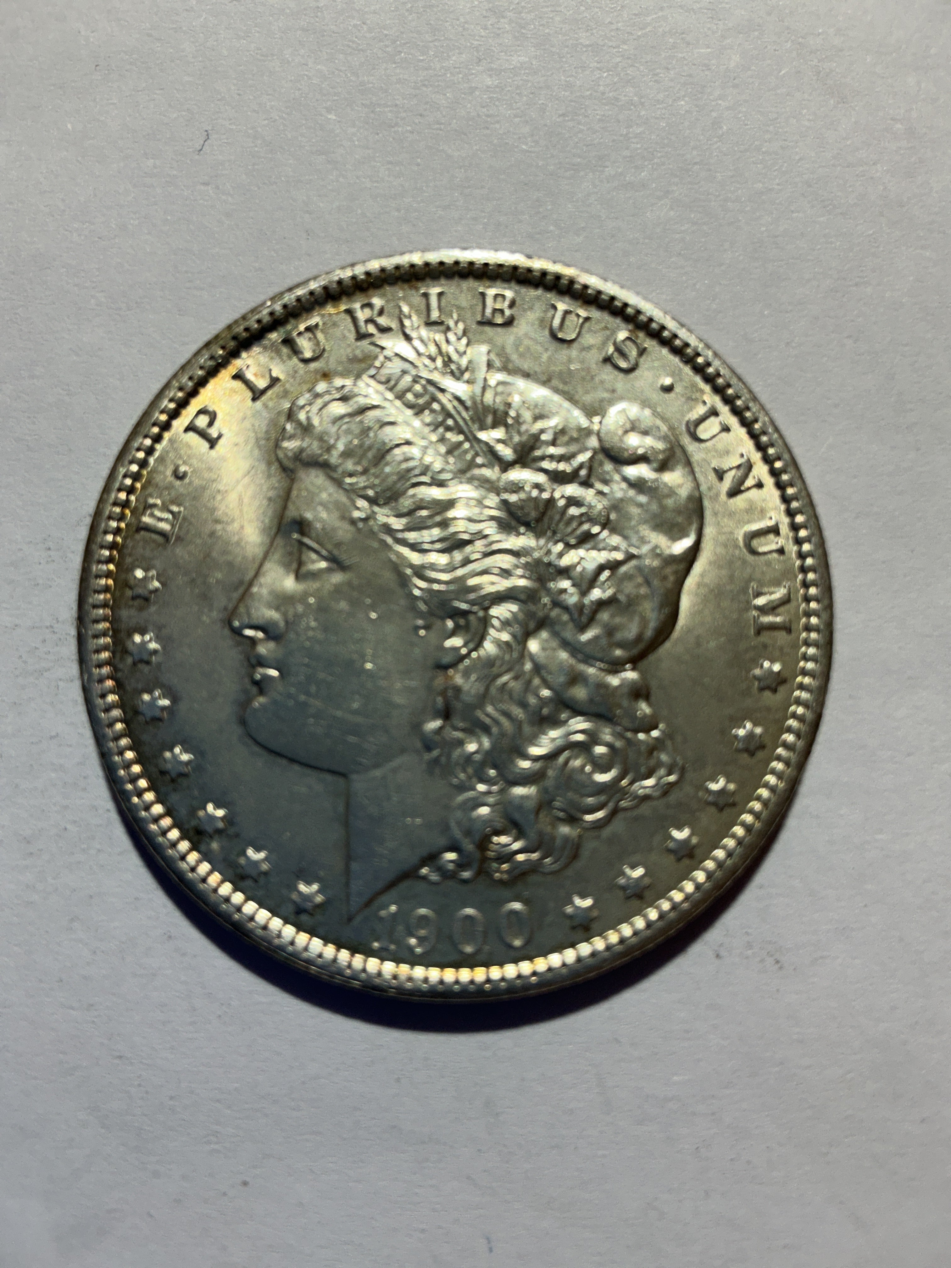 Lot 12, 1900 O Morgan silver dollar, AU