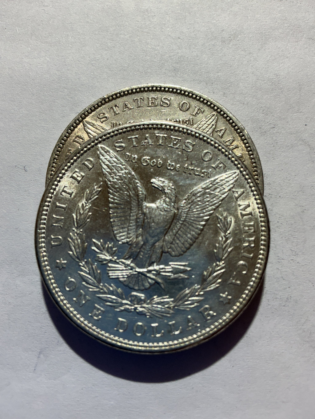 Lot 55, 2 1889 Morgan silver dollar, AU