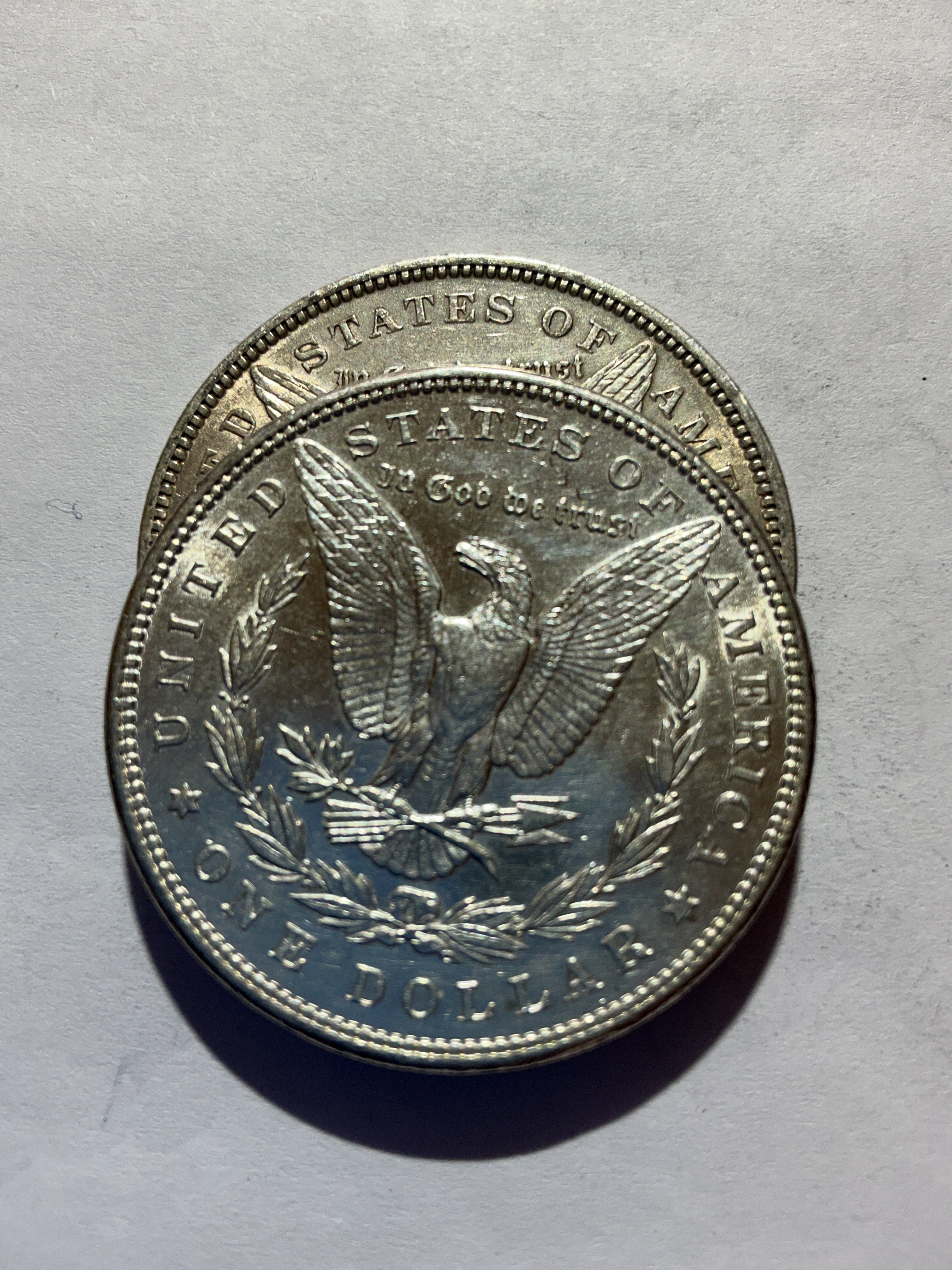Lot 55, 2 1889 Morgan silver dollar, AU