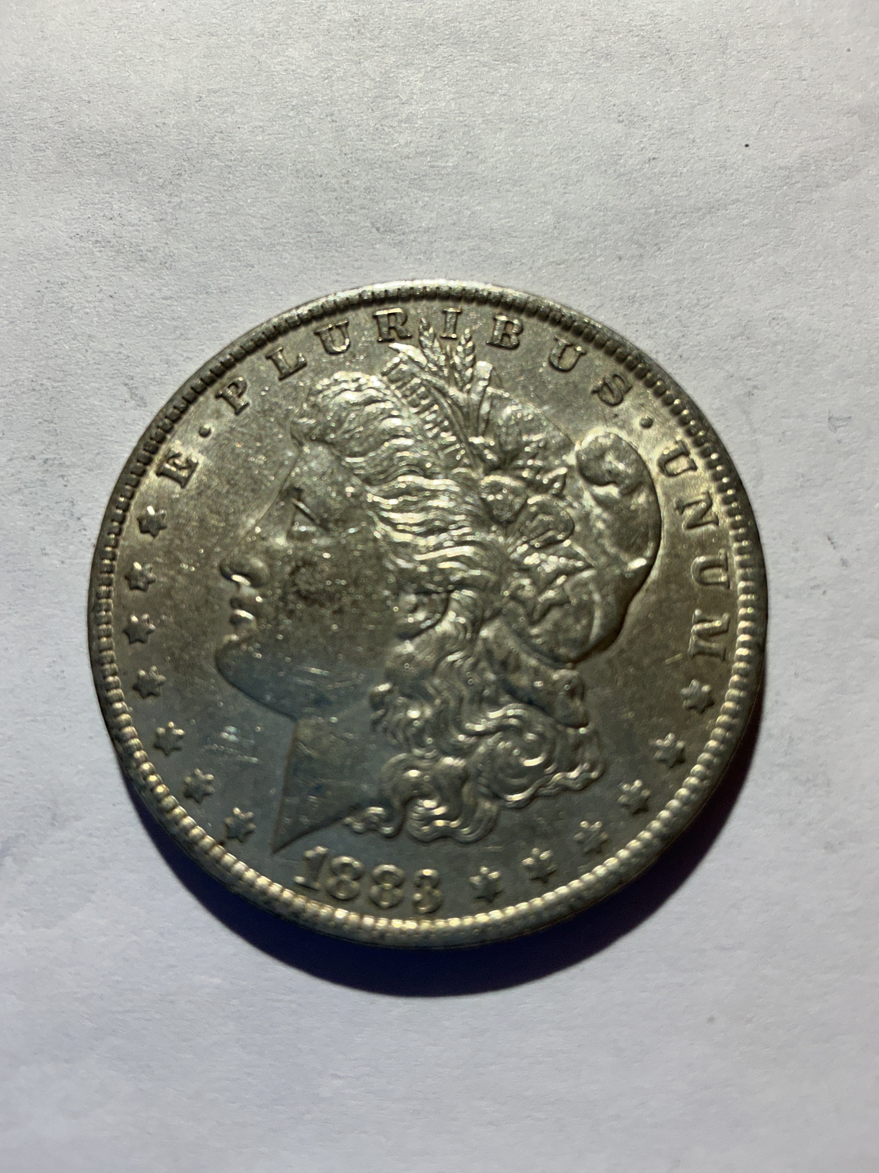 Lot 48, 1883 O Morgan silver dollar, AU