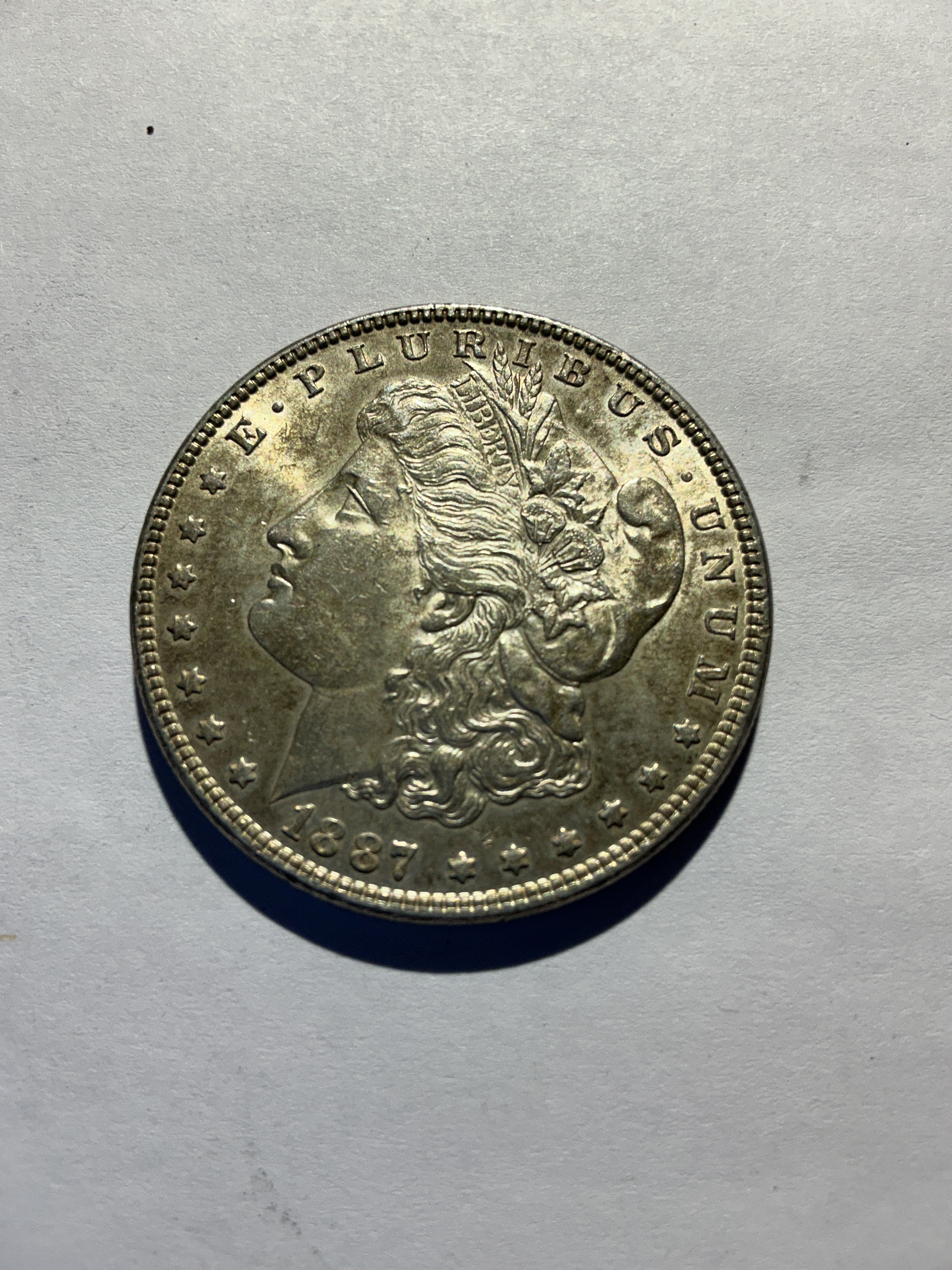 Lot 23, 1887 Morgan silver dollar, AU