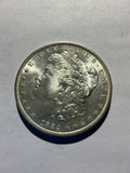 Lot 25, 1884 O Morgan silver dollar, BU