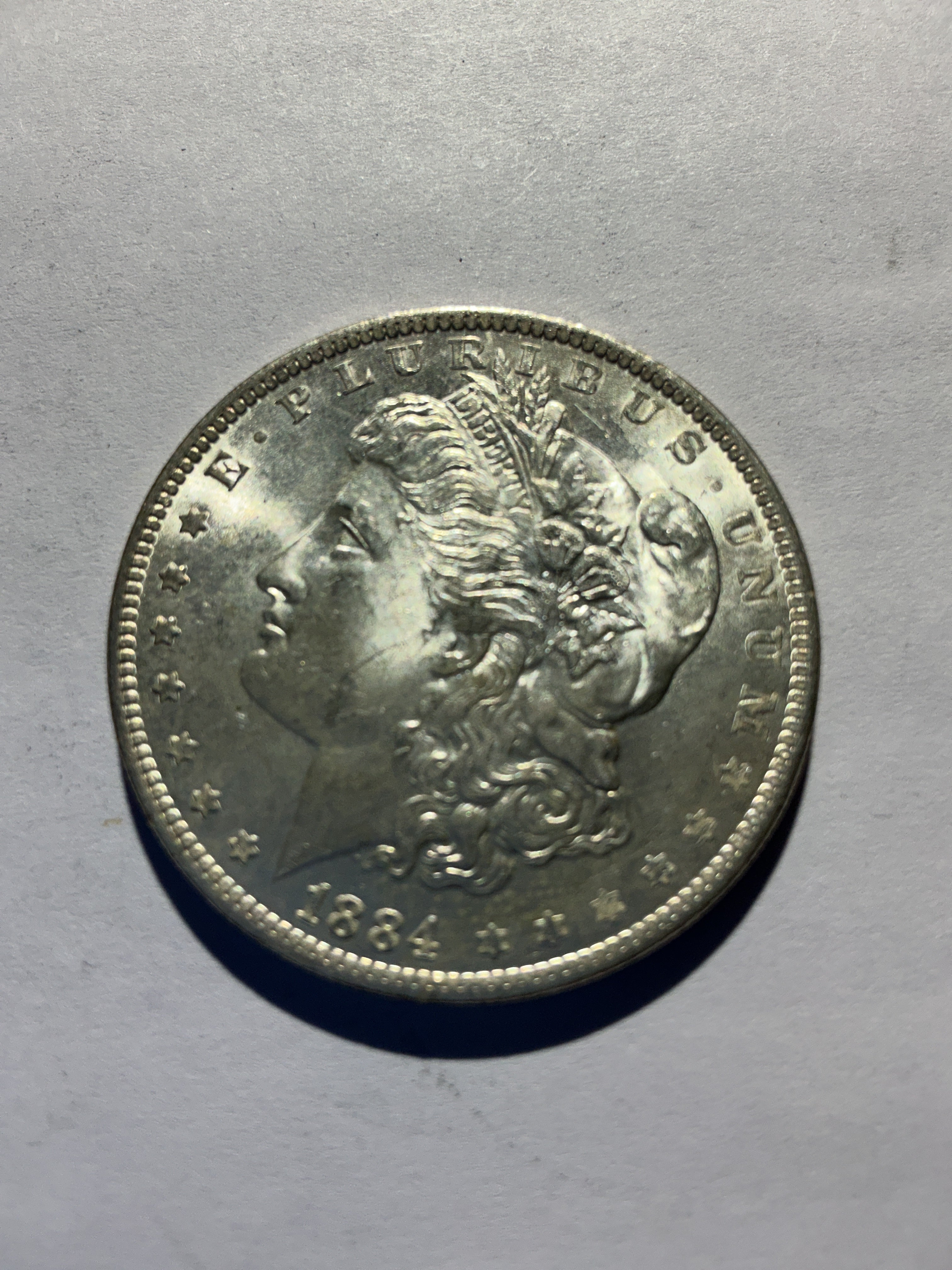 Lot 25, 1884 O Morgan silver dollar, BU