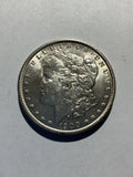 Lot 24, 1900 Morgan silver dollar, AU, nice coin
