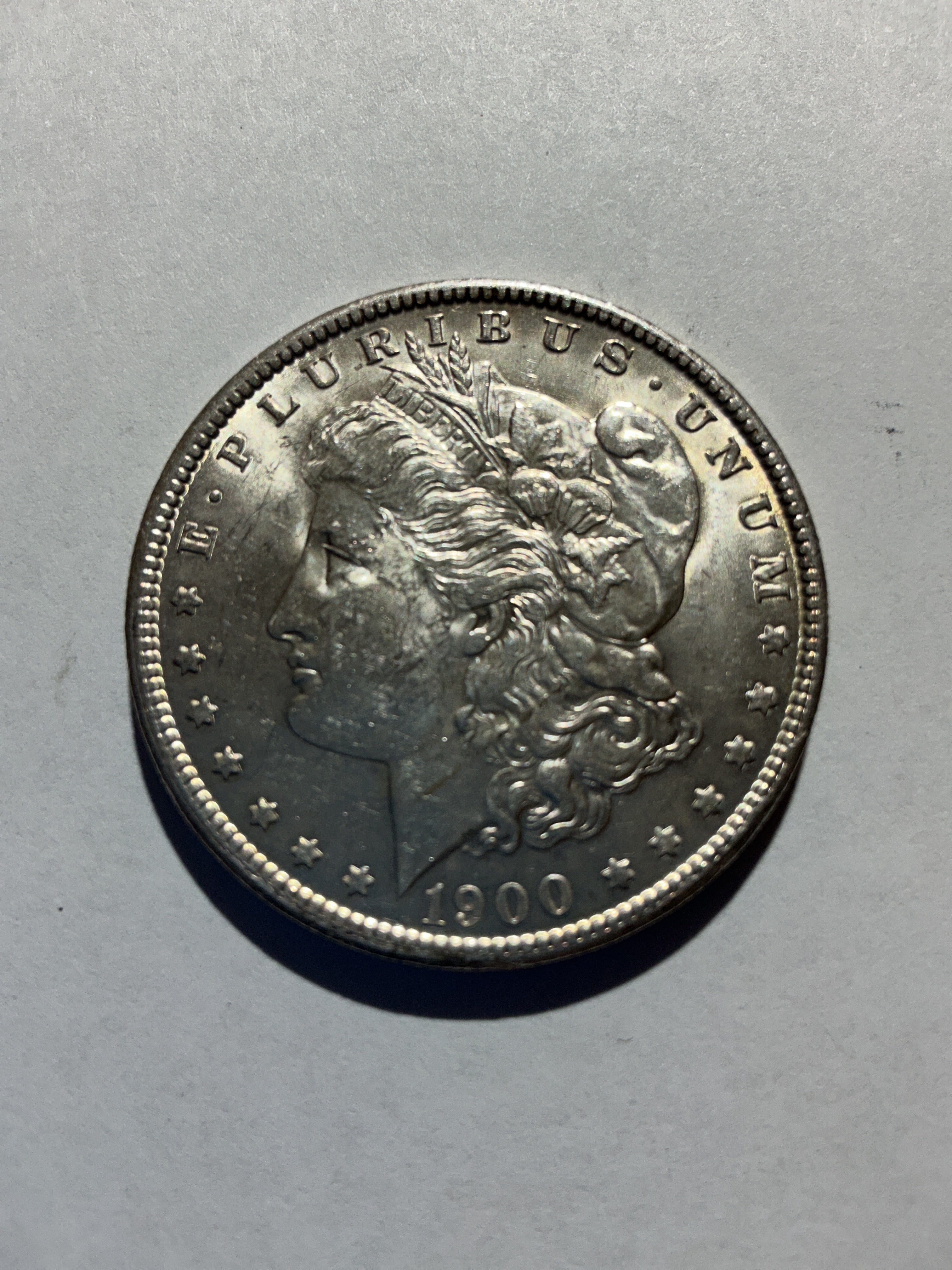 Lot 24, 1900 Morgan silver dollar, AU, nice coin