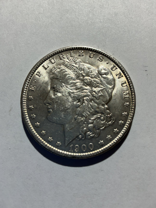 Lot 24, 1900 Morgan silver dollar, AU, nice coin