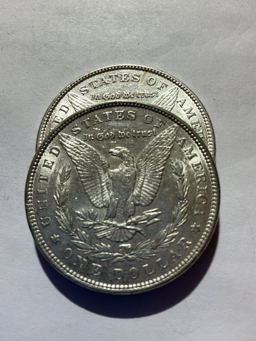 Lot 51, 2 1885 Morgan silver dollar, AU