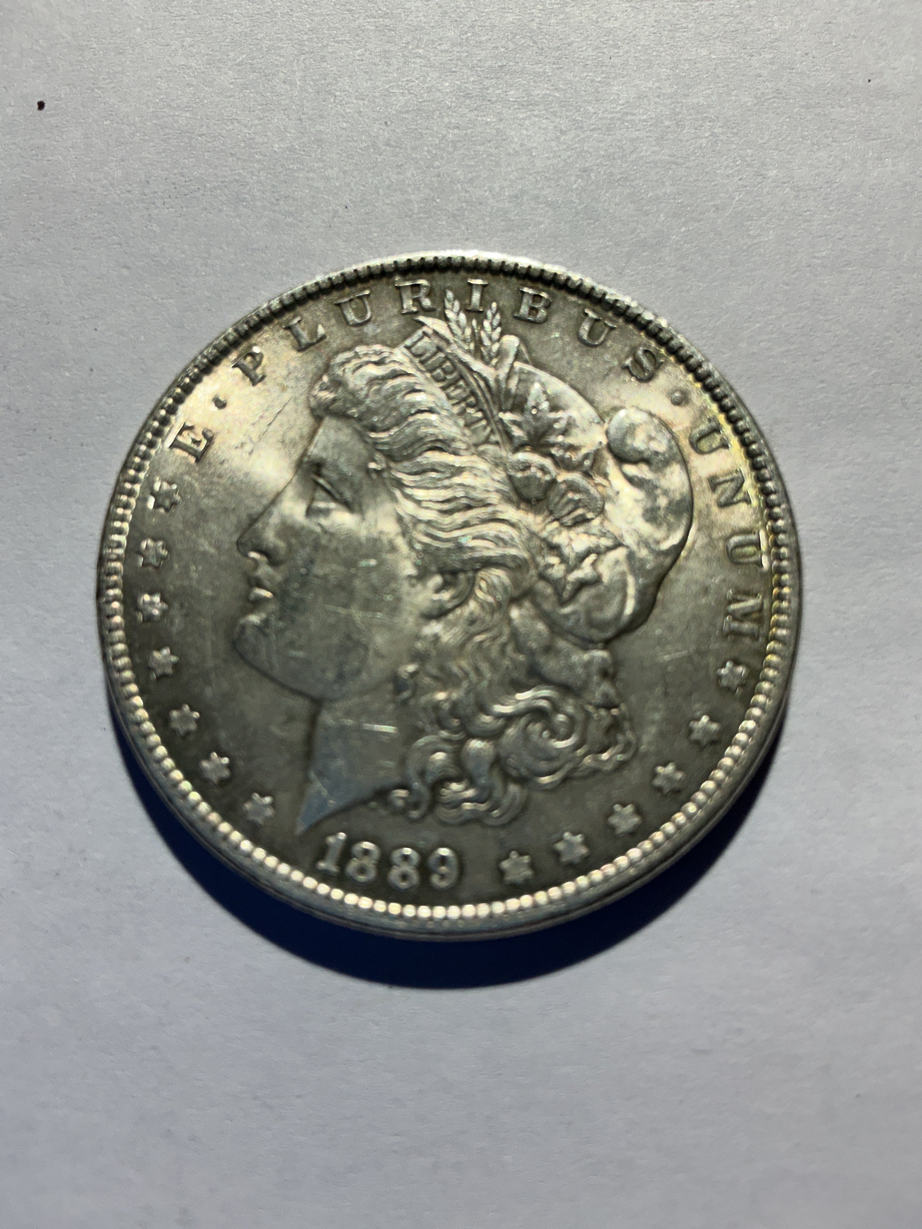 Lot 21, 1889 Morgan silver dollar, AU