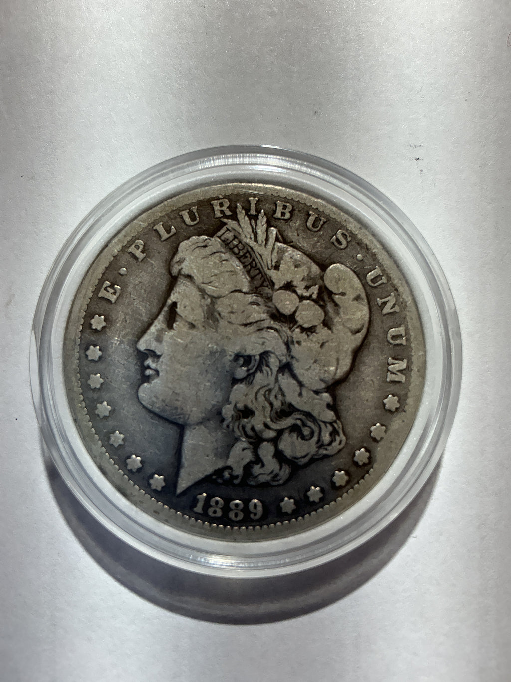 Lot 20, 1889 CC Morgan silver dollar, F, rare coin