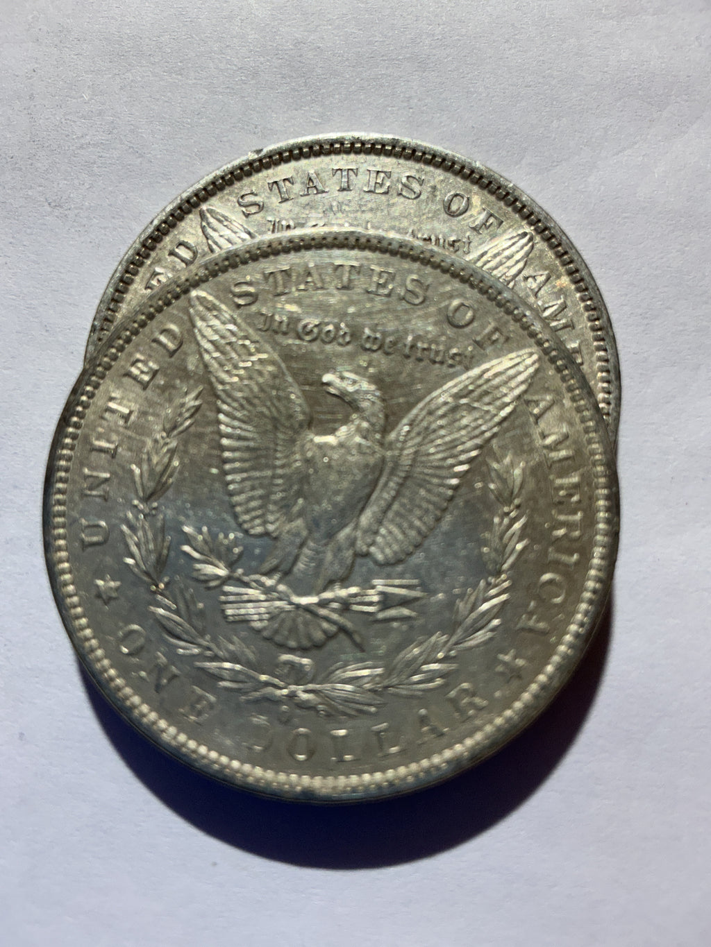 Lot 44, 2 1882 O Morgan silver dollar, AU