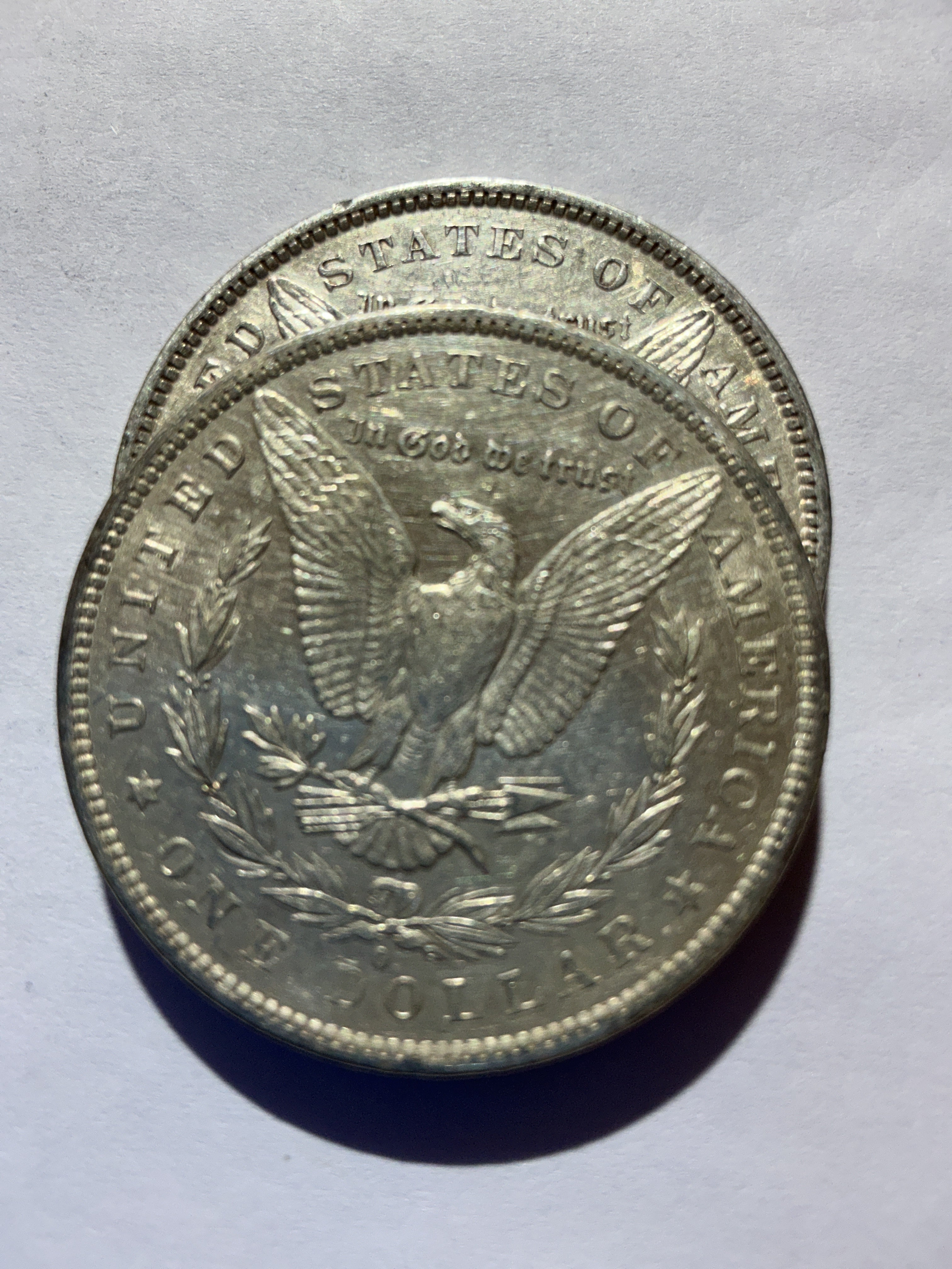 Lot 44, 2 1882 O Morgan silver dollar, AU