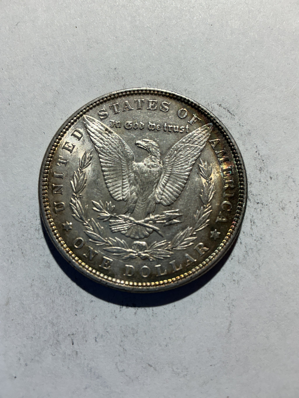 Lot 60, 1886 Morgan silver dollar, AU