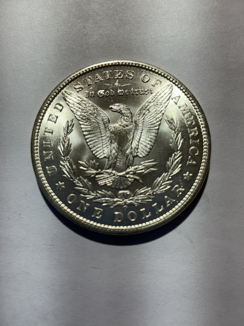Lot 77, 1899 O Morgan silver dollar, BU