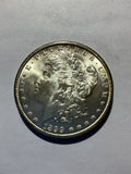 Lot 77, 1899 O Morgan silver dollar, BU