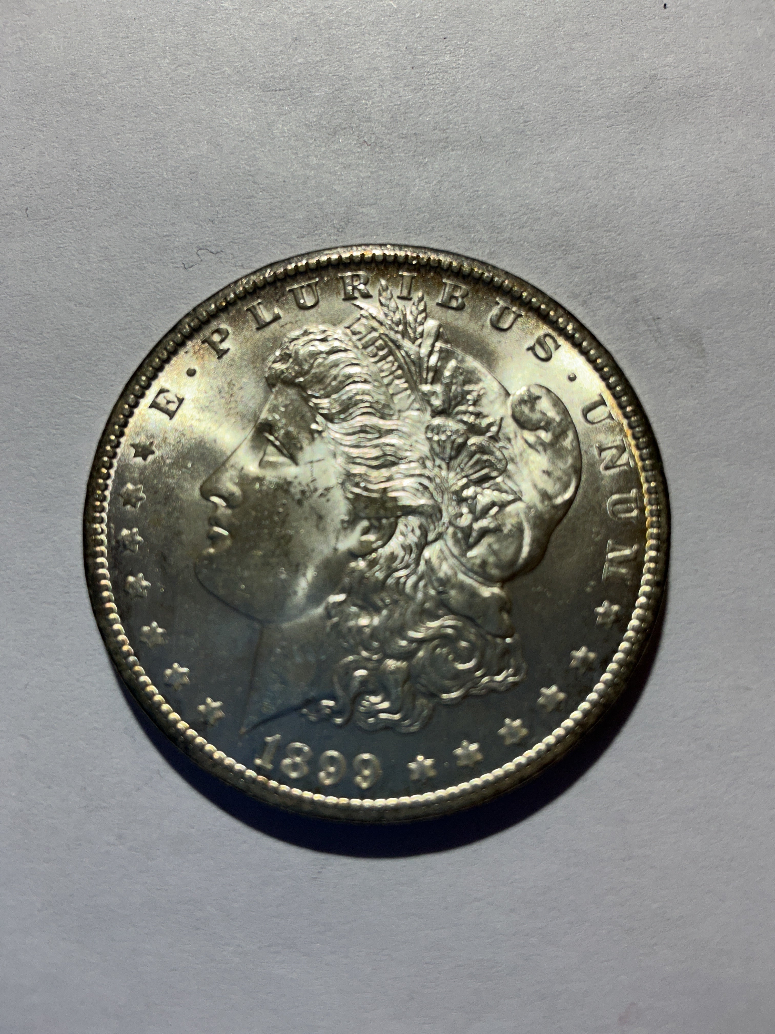 Lot 77, 1899 O Morgan silver dollar, BU