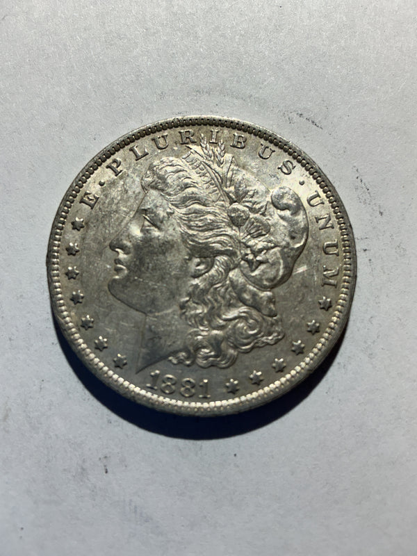 Lot 39, 1881 O Morgan silver dollar, AU