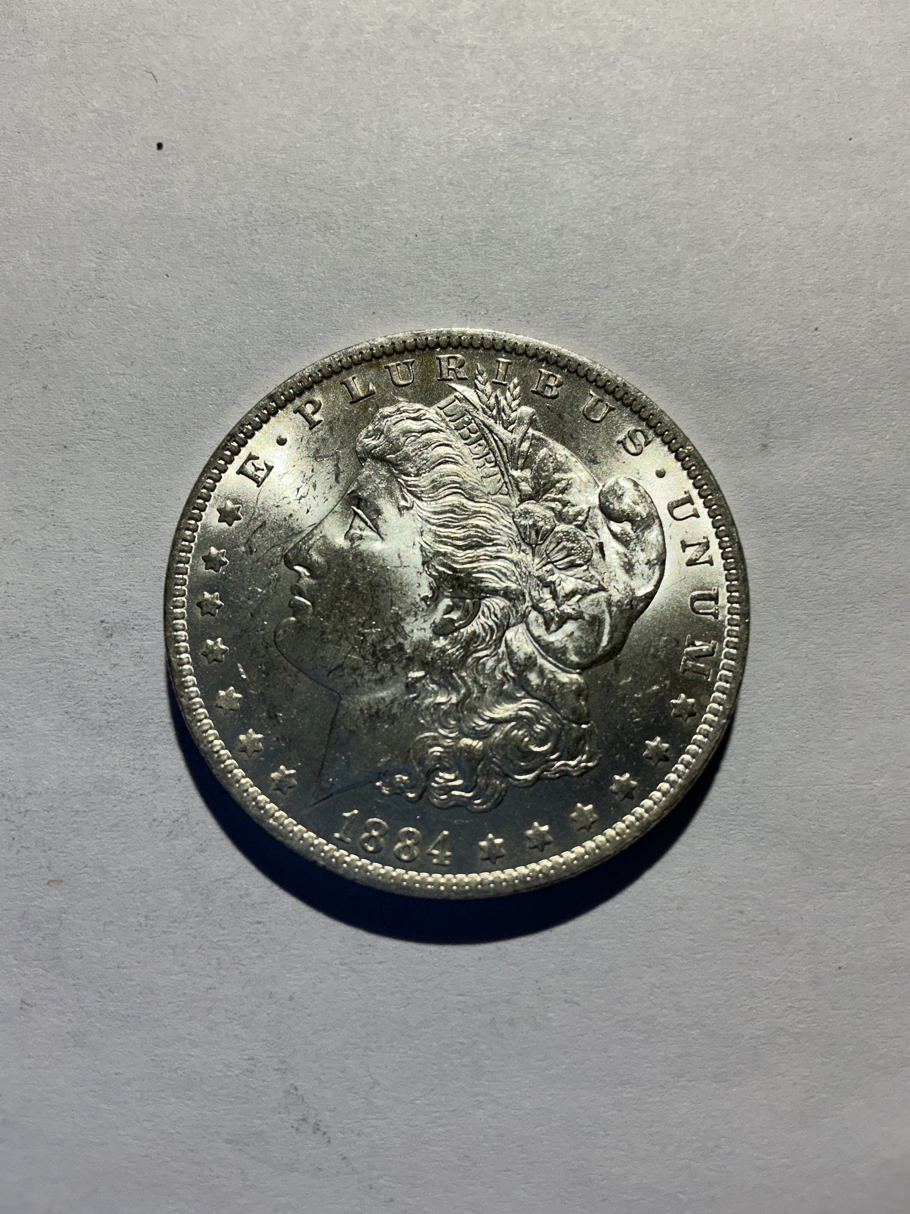 Lot 42, 1884 O Morgan silver dollar, BU