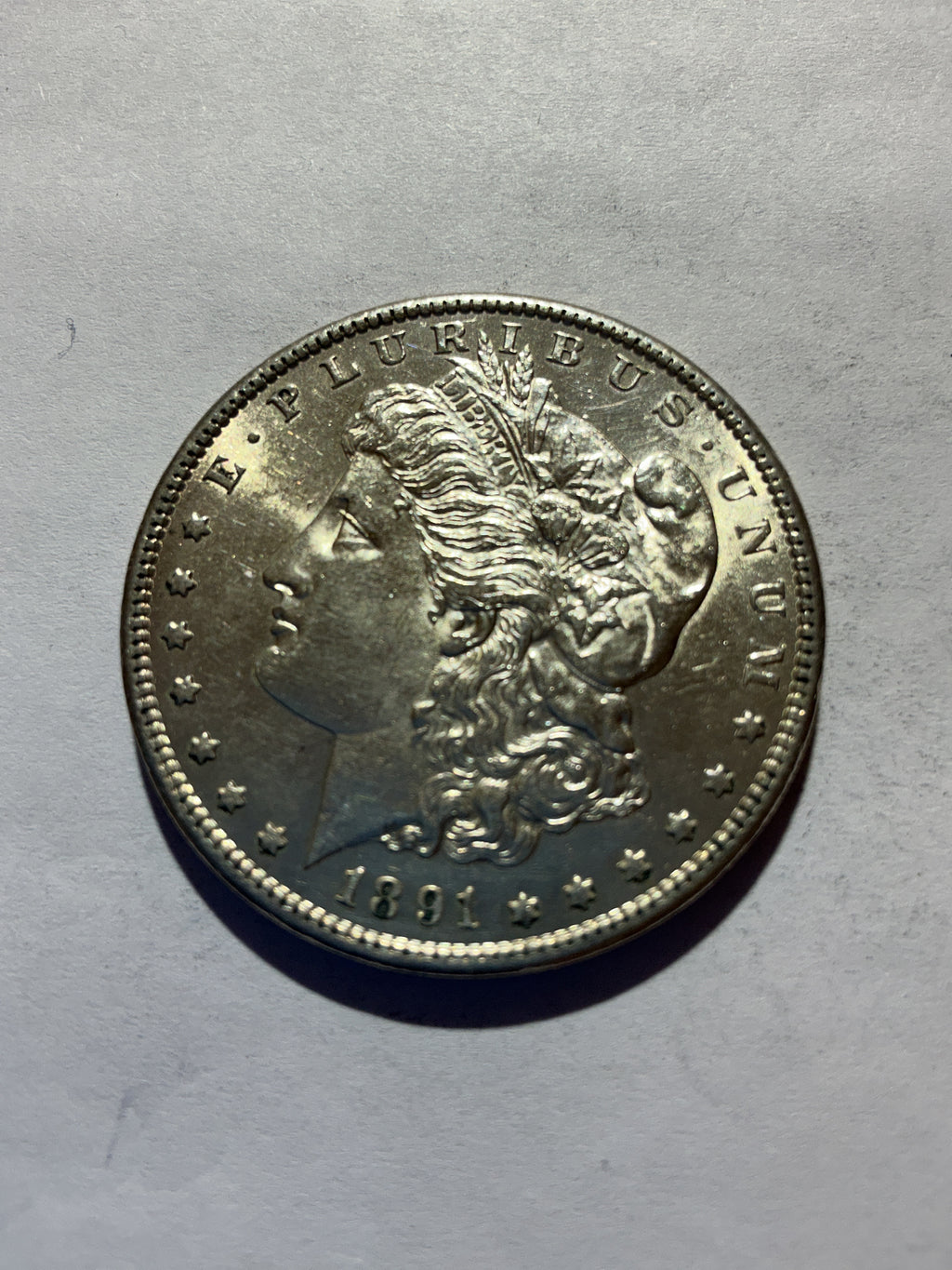 Lot 58, 1891 S Morgan silver dollar, AU