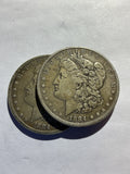 Lot 64, 2/1884 Morgan silver dollar