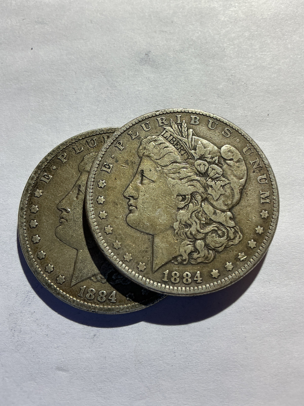 Lot 64, 2/1884 Morgan silver dollar