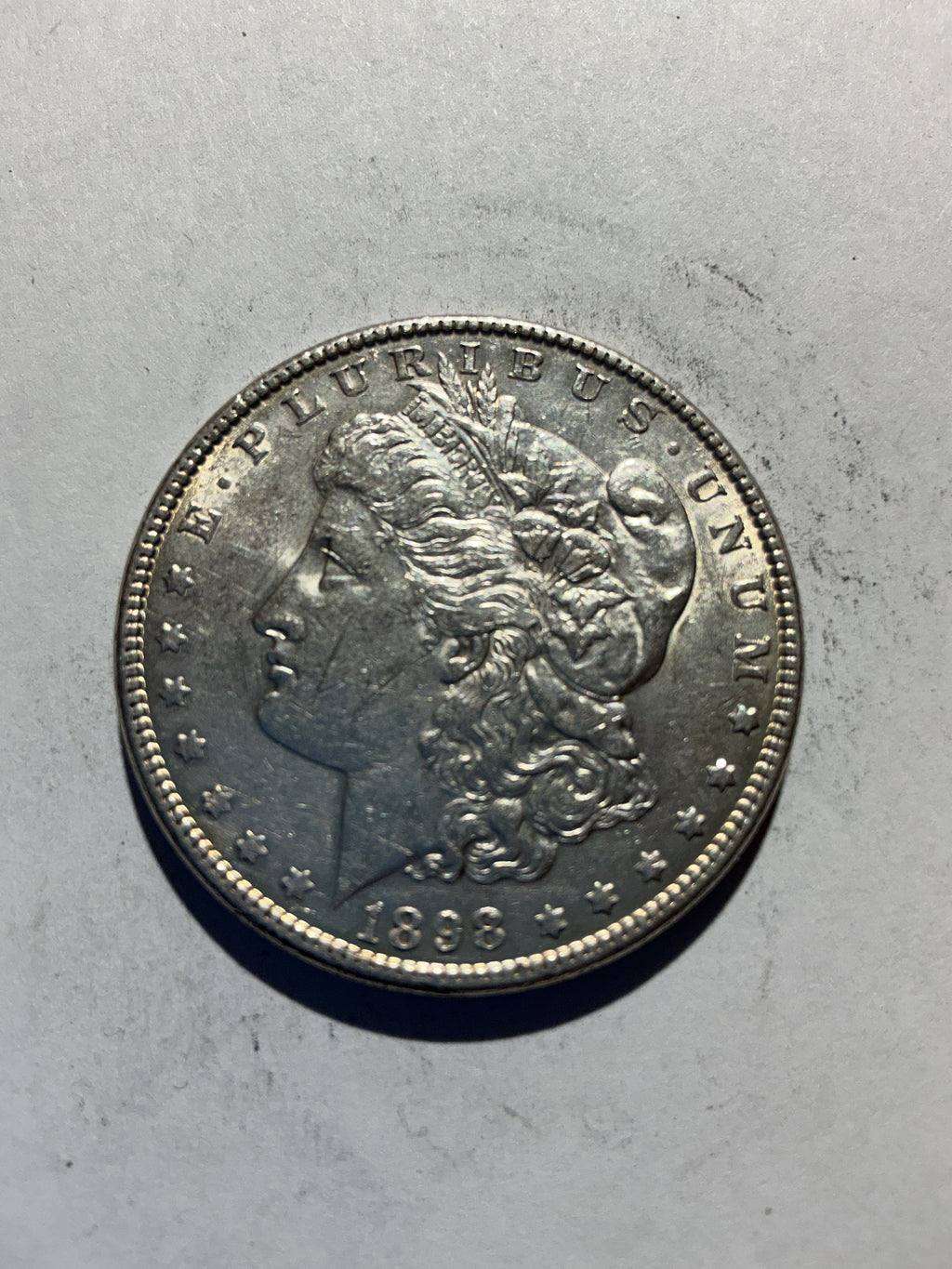 Lot 62, 1898 Morgan silver dollar, AU