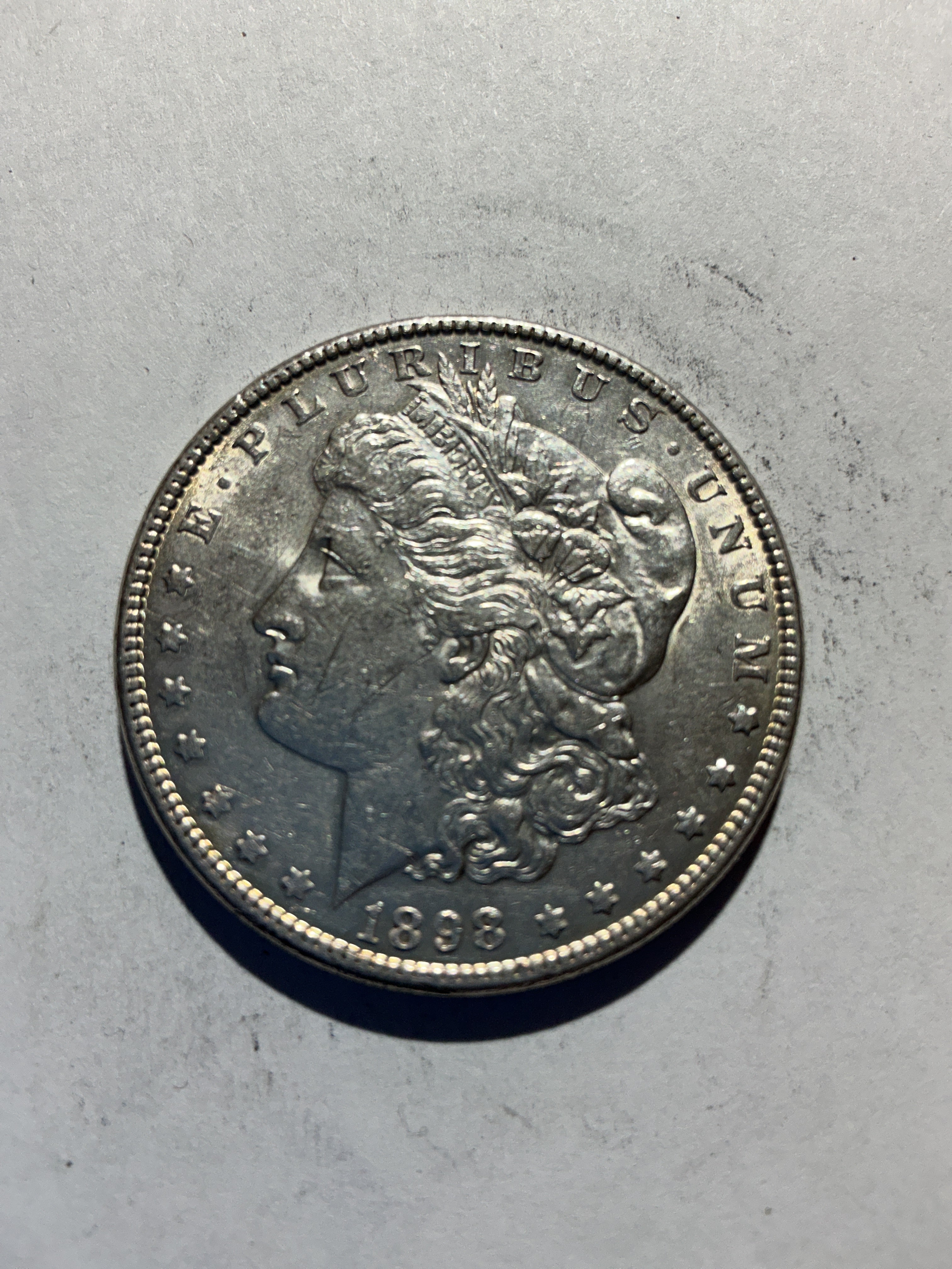 Lot 62, 1898 Morgan silver dollar, AU