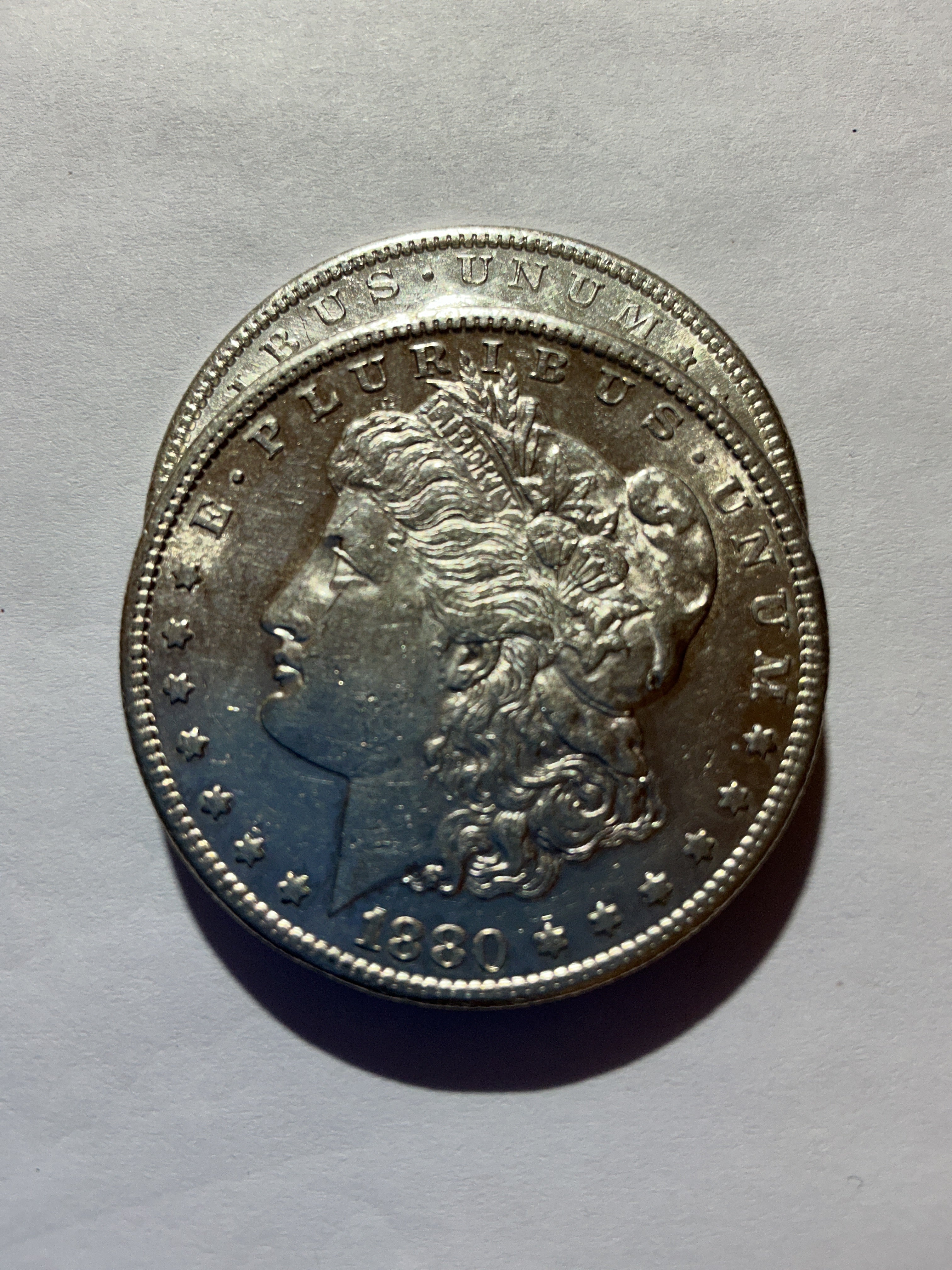 Lot 39, 2 1880 S Morgan silver dollar, AU