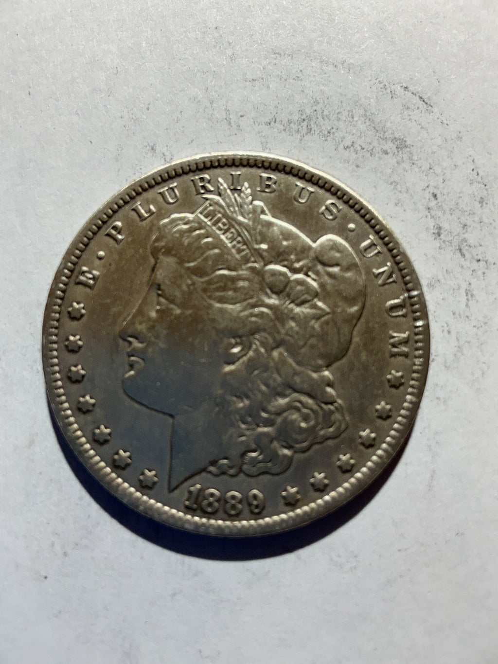 Lot 71, 1889 O Morgan silver dollar, AU