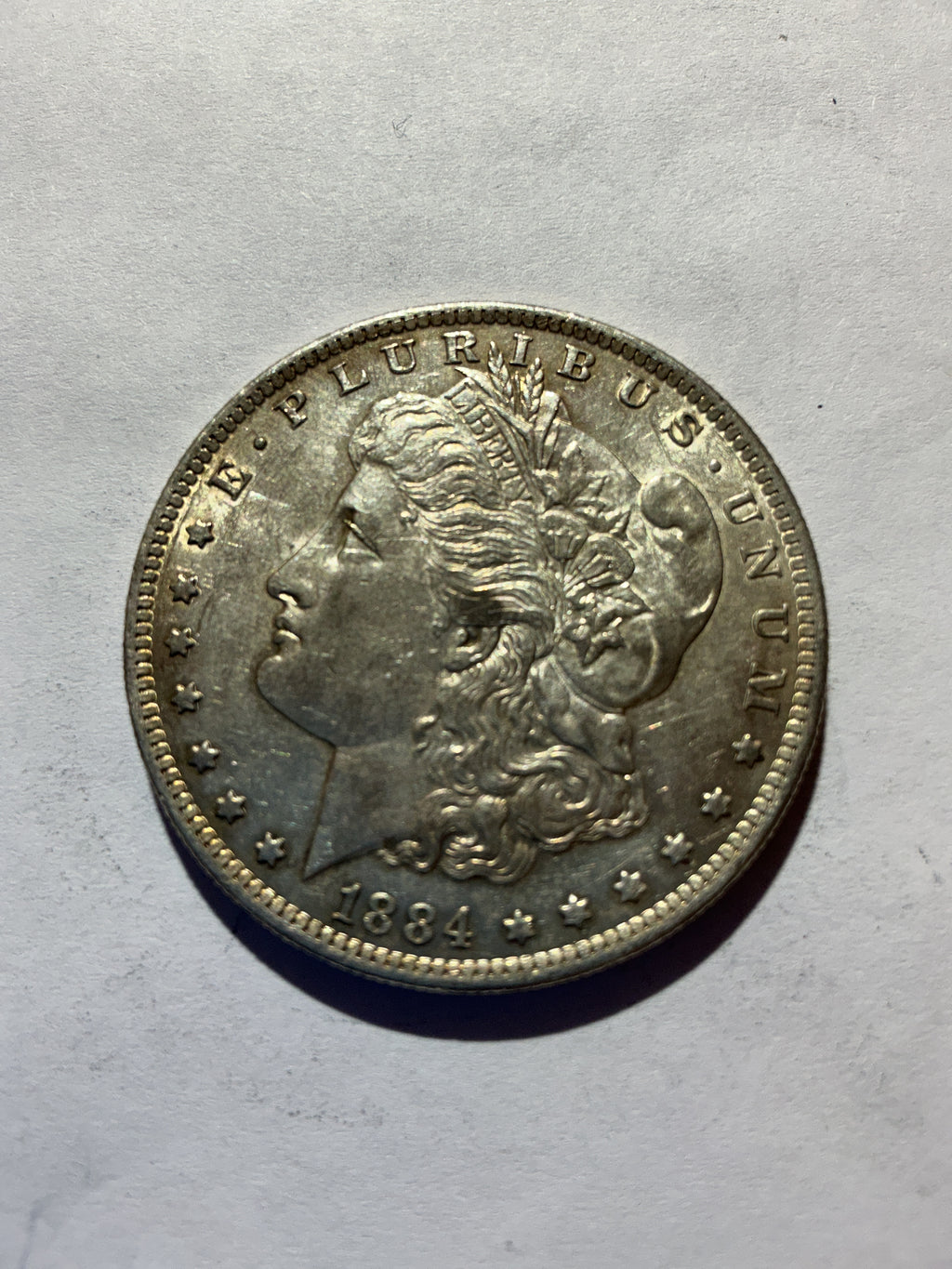 Lot 49, 1884 O Morgan silver dollar, AU